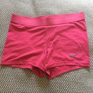 Bright pink Nike Pro shorts